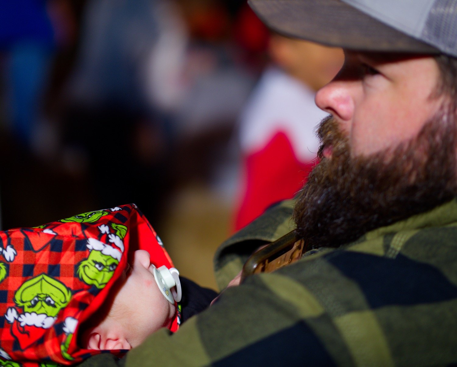 Kaleb Mosley holds Harrison, born Sept. 11 this year, soon to see his first Christmas. As a veteran and first-responder, Mosley expressed how that date has a rather different feeling now. [hometown Xmas highlights]